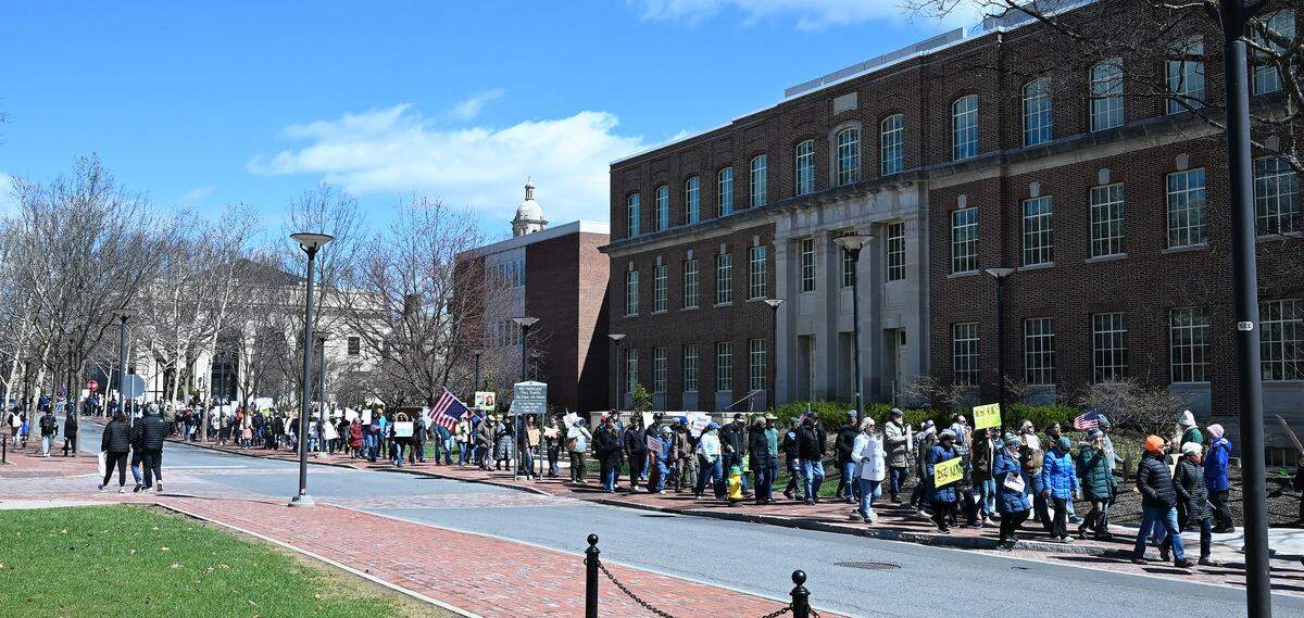 Protesters marched through the Penn State campus following a rally as part of the third No Kings event Saturday.