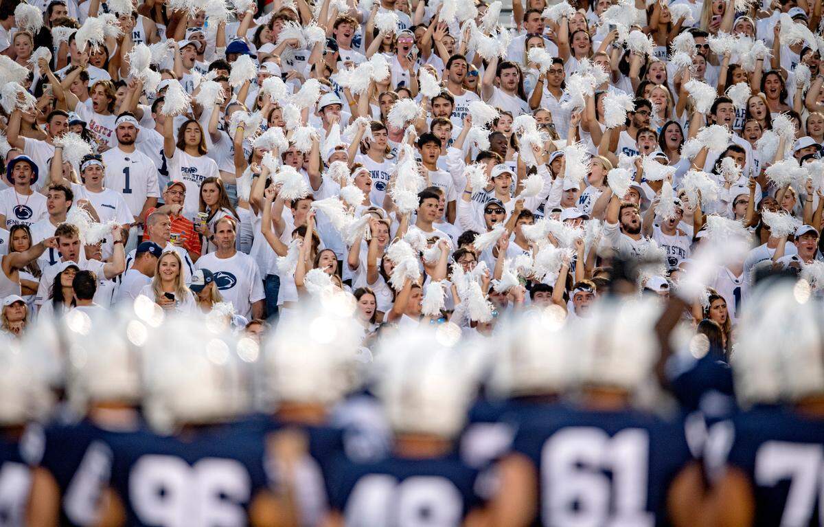 The Penn State student section cheers as the Nittany Lions huddle up during pregame on Saturday.