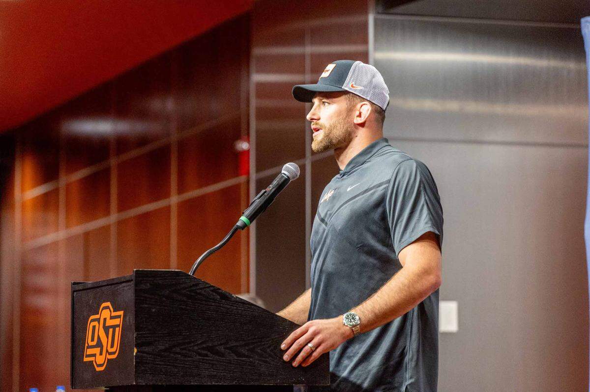 David Taylor talks during his introductory press conference Friday in Stillwater, Oklahoma, at Boone Pickens Stadium. He is the Oklahoma State Cowboys’ new wrestling head coach.