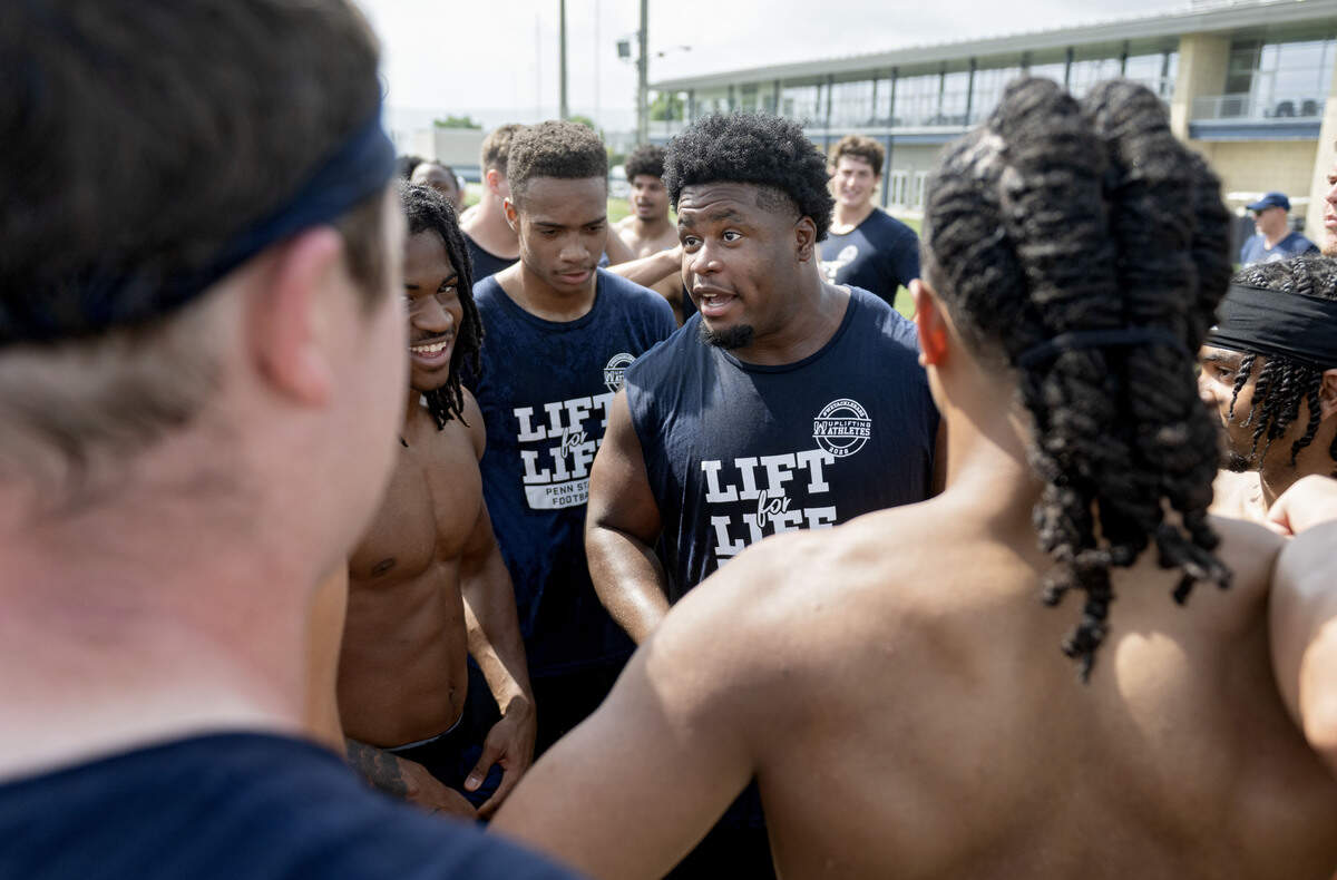 Penn State defensive tackle Armstrong Nnodim talks with teammates after Lift For Life on Wednesday, July 1, 2026.