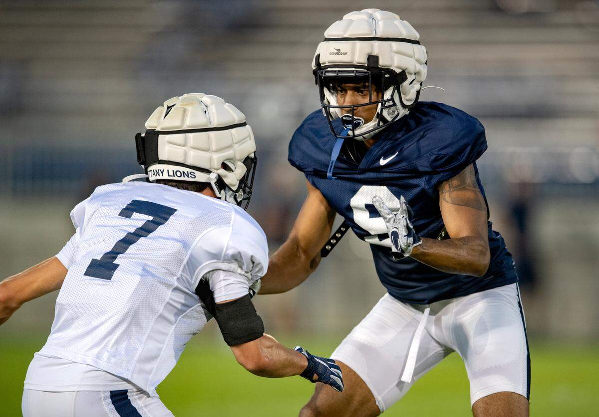 Penn State safety Jaylen Reed and cornerback Joey Porter Jr. run a drill during practice on Wednesday, Aug. 25, 2021 in Beaver Stadium.