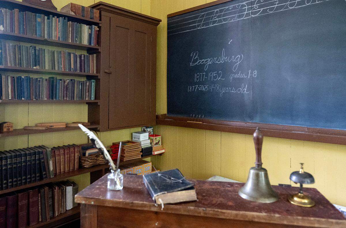 A chalkboard and books are pictured in the Boogersburg School, a one-room schoolhouse off of Fox Hill Road.