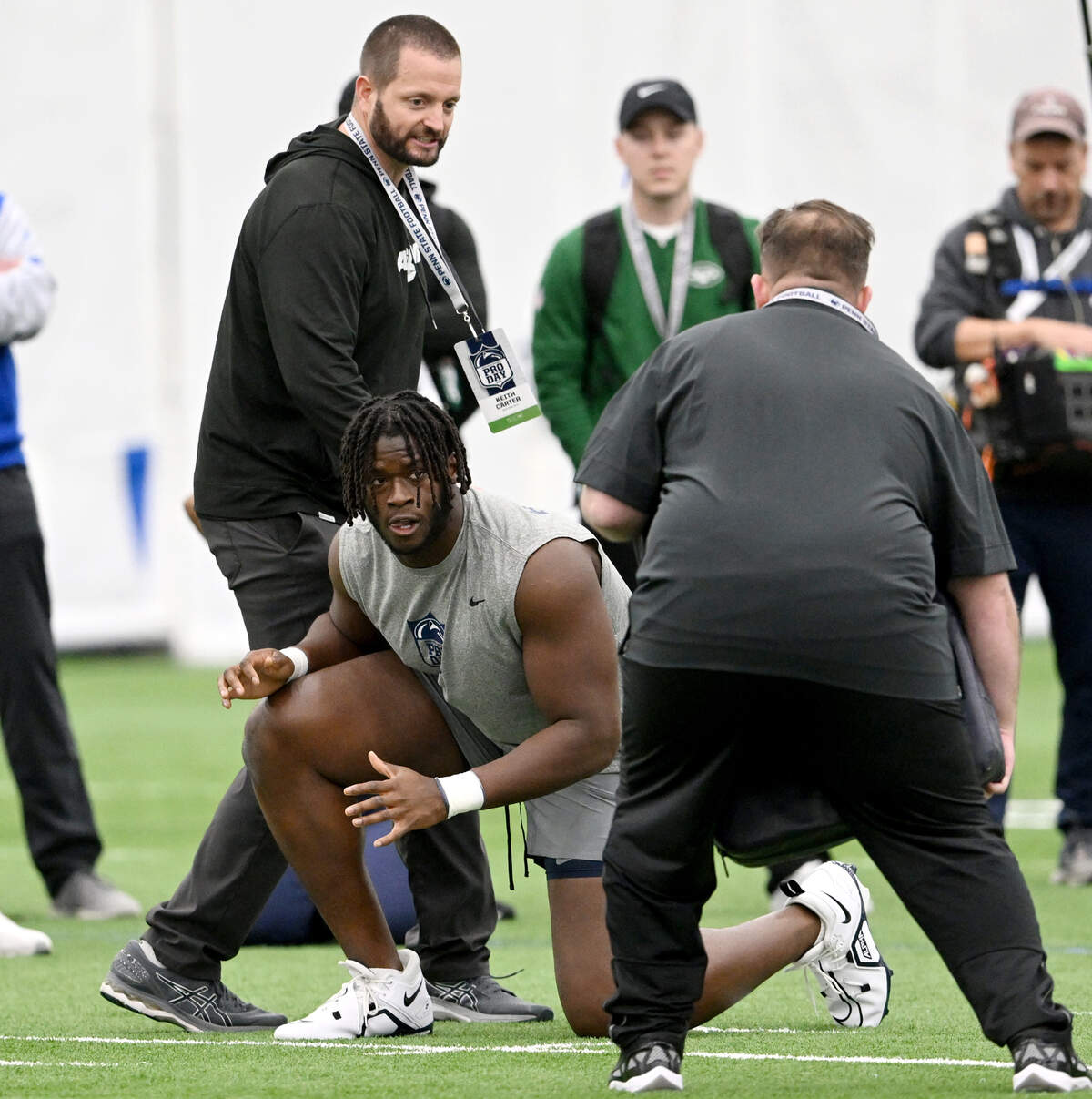 Offensive lineman Olu Fashanu listens to the directions from NFL scouts as he runs position drills at Penn State’s Pro Day on Friday, March 15, 2024 in Holuba Hall.