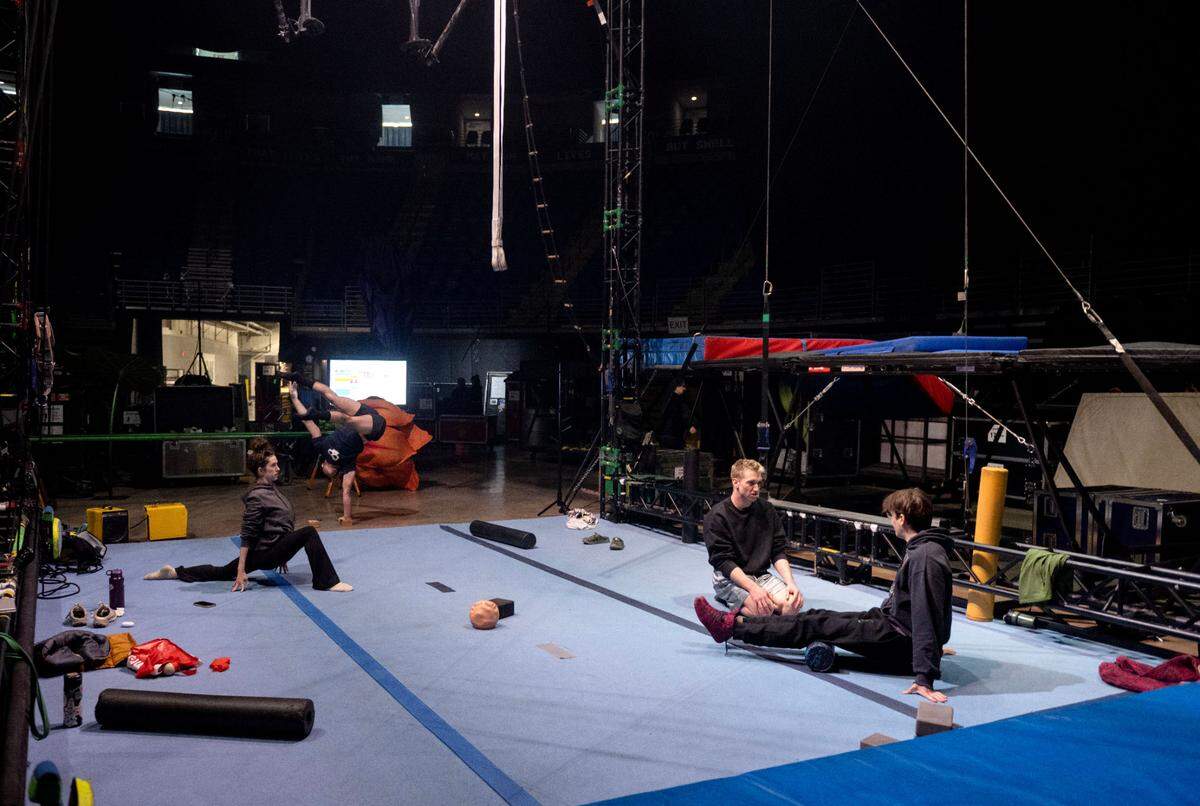 Performers stretch and rehearse back stage before opening night of “Ovo,” a Cirque du Soleil show, at the Bryce Jordan Center on Thursday, March 27, 2025.
