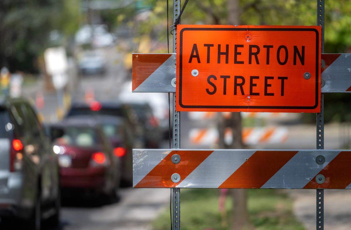 Construction delays traffic along South Atherton Street on April 27, 2023.