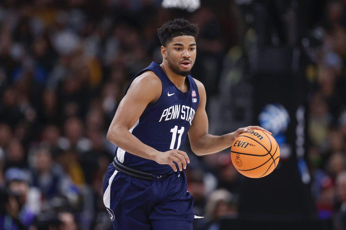 Penn State guard Cam Wynter (11) brings the ball up court against Purdue during the first half Sunday at United Center.