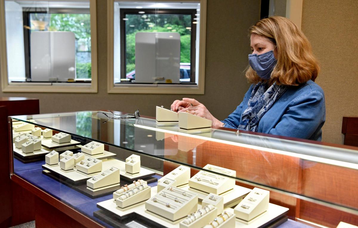 Barbara Miska arranges the rings for a display at Miska Jewelers in downtown State College on Friday, May 8, 2020. The jewelers store had new precautions in place as they reopened.