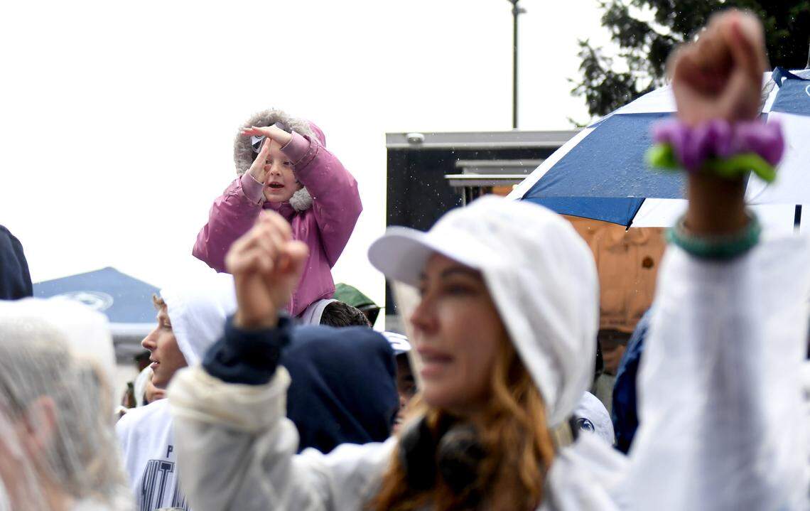 A young fan makes a “t” as the Penn State is spelled out before team arrival for the Blue-White Practice on Saturday, April 25, 2026.  