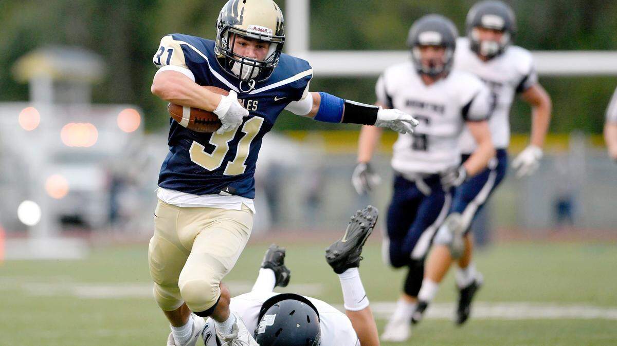 Bald Eagle Area’s Gage McClenahan pulls away from Philipsburg-Osceola defenders earlier this season.