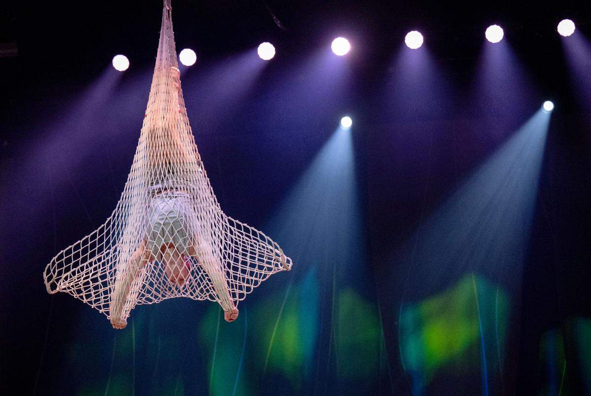 Beau Sargent rehearses his aerial net routine in Cirque du Soleil’s show “Ovo” at the Bryce Jordan Center on Thursday, March 27, 2025.