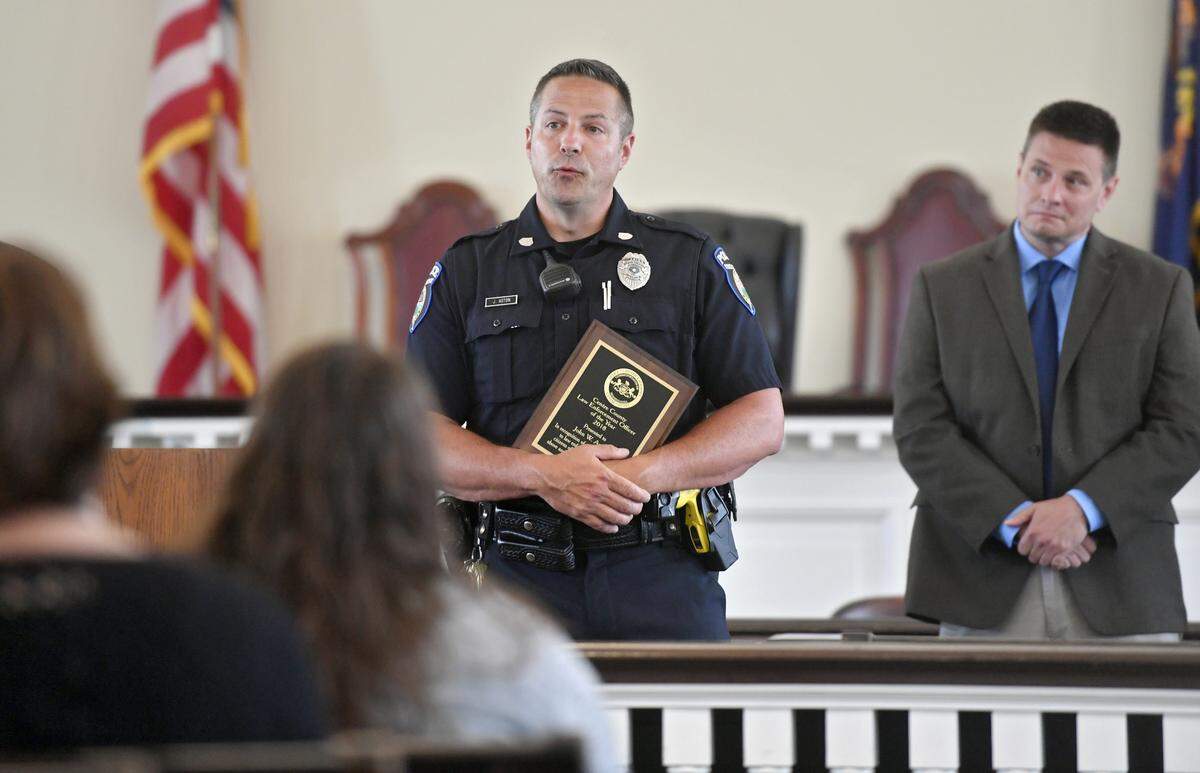 State College police officer John W. Aston speaks after being awarded with the 2018 Centre County Law Enforcement Officer of the Year award on Tuesday at the Centre County Courthouse. State police trooper Jeff Ebeck also received an award.