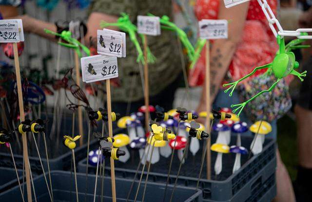 Bees, frogs, mushrooms and more at the Metal Illusions booth at the People’s Choice Festival on Friday, July 14, 2023. All the creations are made from recycled metals and are powder coated to last outside.