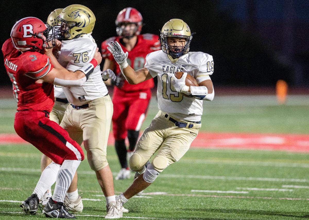 Bald Eagle Area’s Camron Watkins, right, cuts down the field with the ball during the game against Bellefonte on Friday, Sept. 9, 2022.