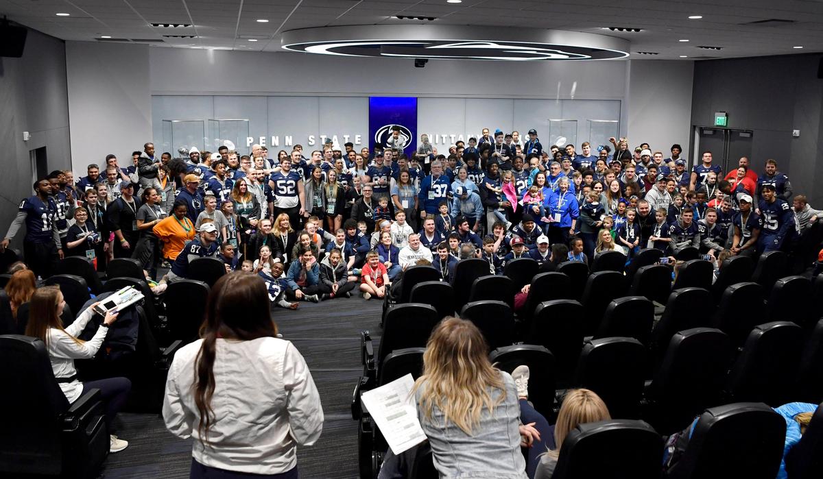 Penn State football players and Four Diamond families gather for a group photo at the Lasch Building on Saturday, Feb. 22, 2020.