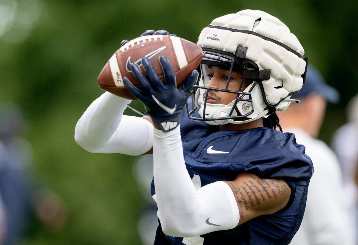 Penn State safety Kevin Winston Jr. catches a ball off the jugs machine during the first day of practice on Monday, Aug. 1, 2022.
