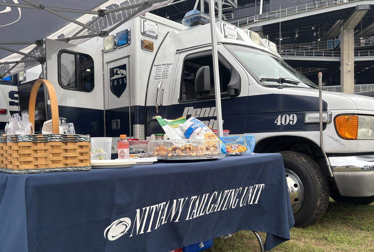 A small tailgate spread in a parking lot outside Beaver Stadium ahead of the Penn State vs. Oregon game on Sept. 27, 2025.