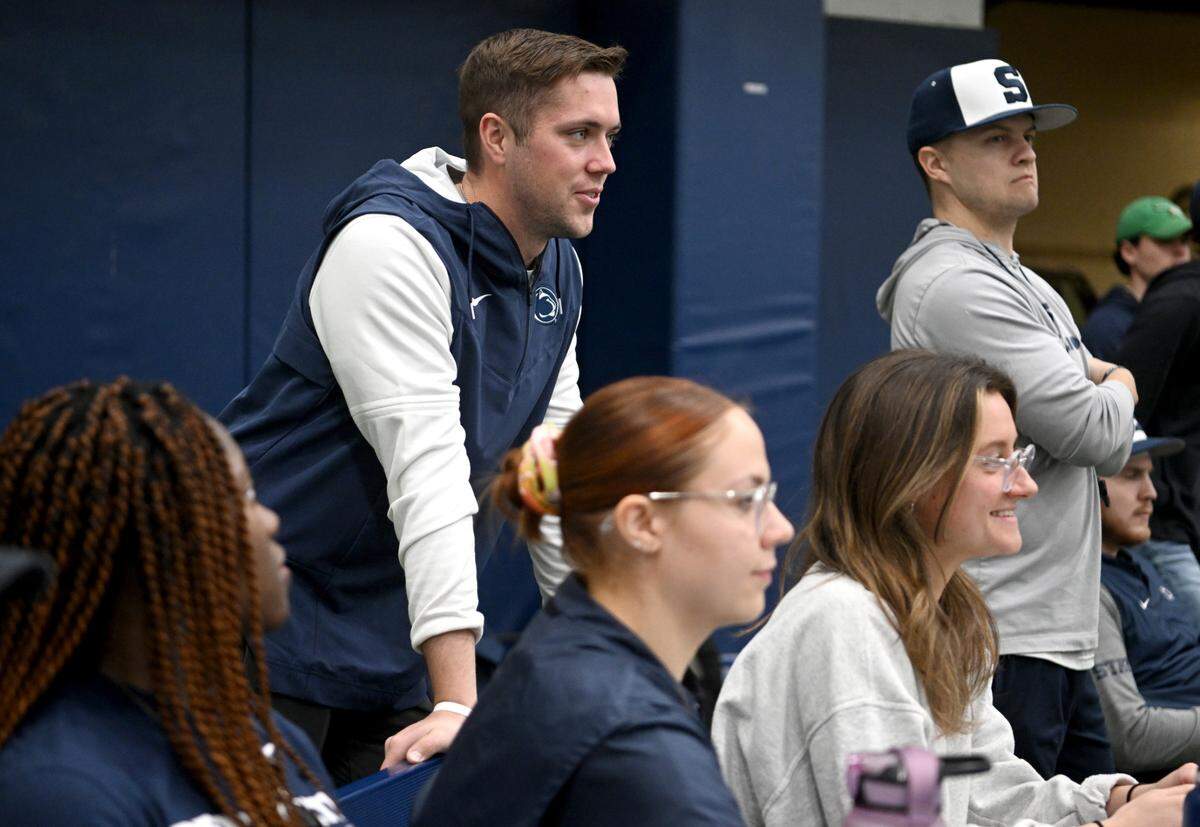 Penn State baseball’s director of operations and player development Jake Stone talks with student managers as they track pitching and hitting during practice on Thursday, Feb. 9, 2023 in Holuba Hall.