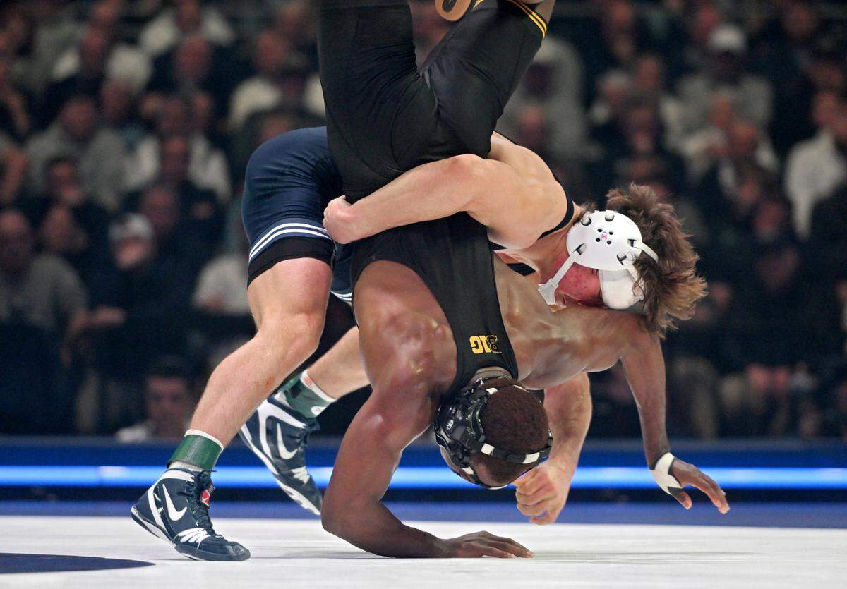 Penn State’s Tyler Kasak flips Iowa’s Jacori Teemer in the 157-pound bout of the match on Friday, Jan. 31, 2025 at the Bryce Jordan Center. Kasak won by decision, 5-2.