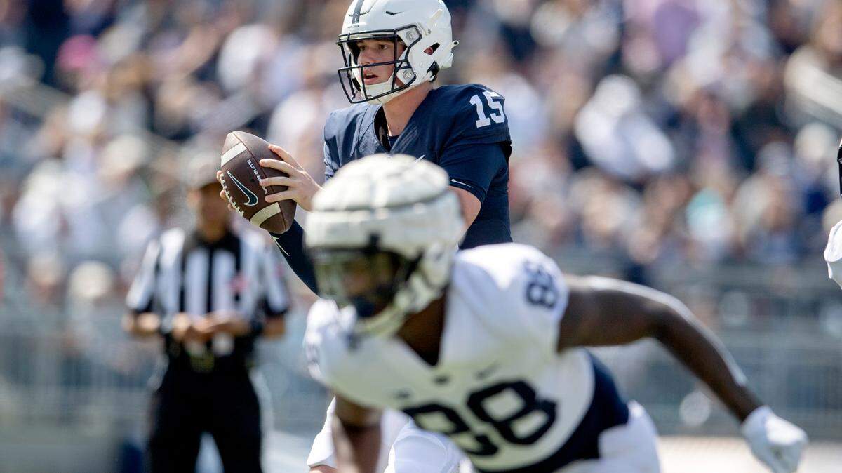 Penn State quarterback Drew Allar takes a snap during the Blue-White game Saturday, April 23, 2022.
