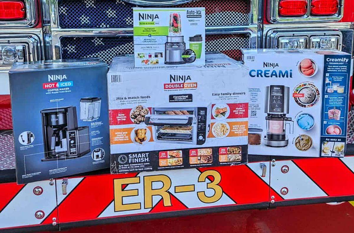 A bundle of things raffled to raise money for the Boalsburg Fire Company sit on the front of one of the company’s trucks.