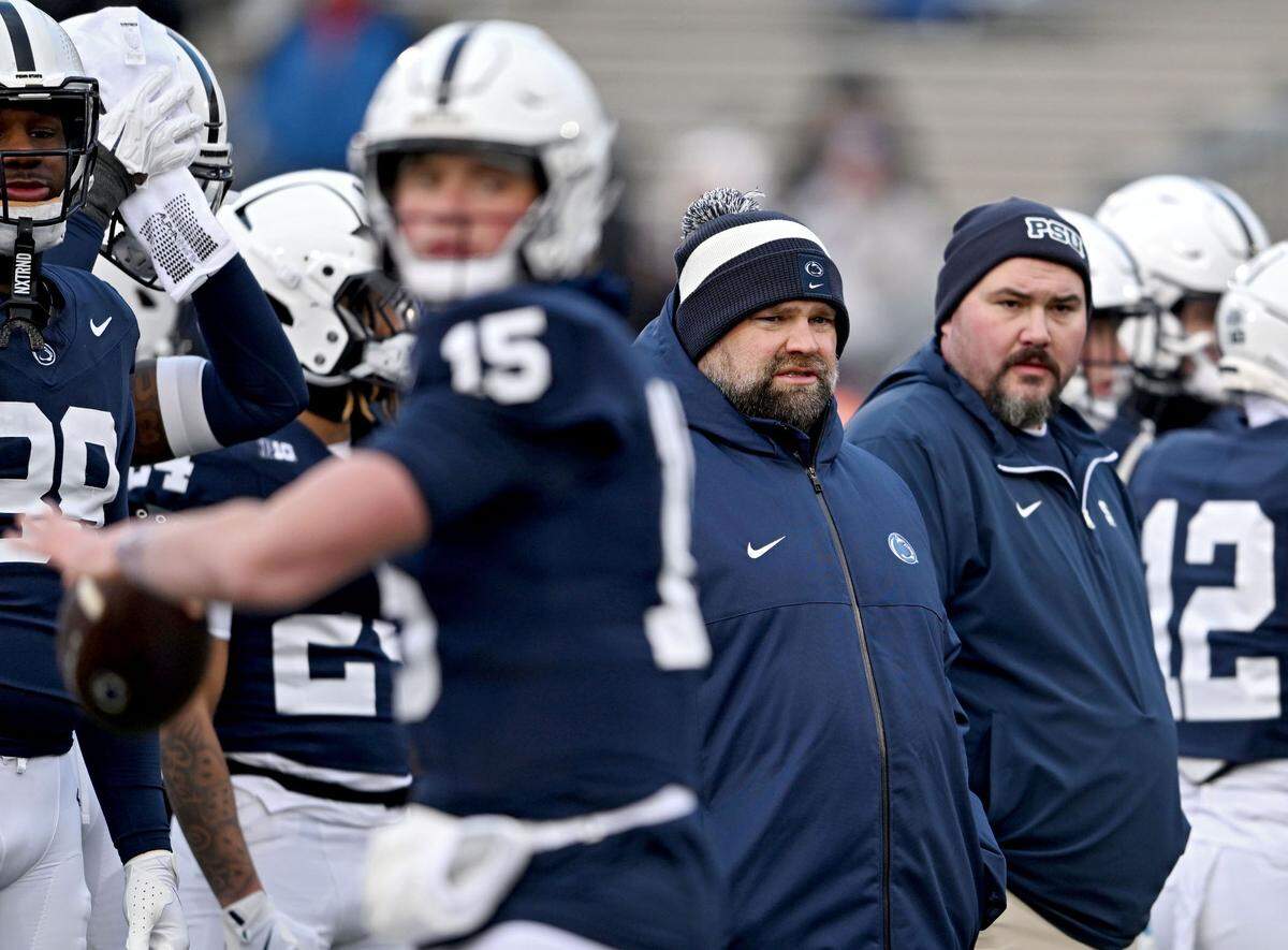 Penn State offensive coordinator Andy Kotelnicki watches quarterback Drew Allar make pass during warm ups for the game against Maryland on Saturday, Nov. 30, 2024 at Beaver Stadium.