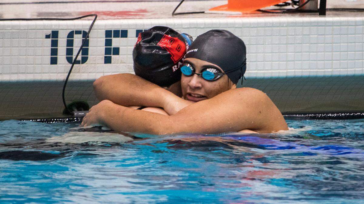 After finishing the Girl’s 100 Yard Freestyle in the AA Bracket, Bellefonte Area High School sophomore Addie Pringle hugs Bald Eagle Area High School senior Alaina Cane along the edge of the pool during the PIAA Swimming and Diving 2023 District 6 Championship held at the McCoy Natatorium on Saturday, Mar. 4, 2023, in University Park. Pringle placed sixth in her event with a final time of 0:57.52.
