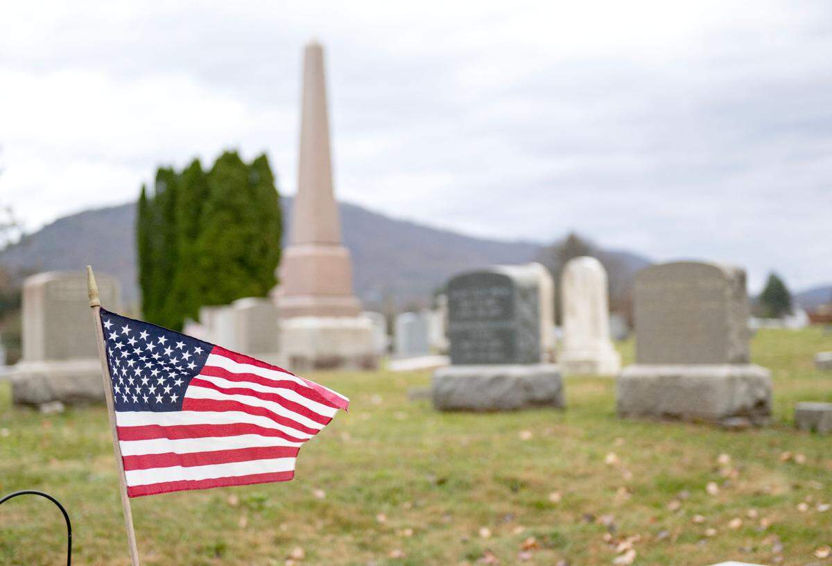 A flag waves in the wind at the Union Cemetery in Bellefonte Wednesday, Nov. 6, 2024. The cemetery will host a Veterans Day ceremony on Sunday, Nov. 10.