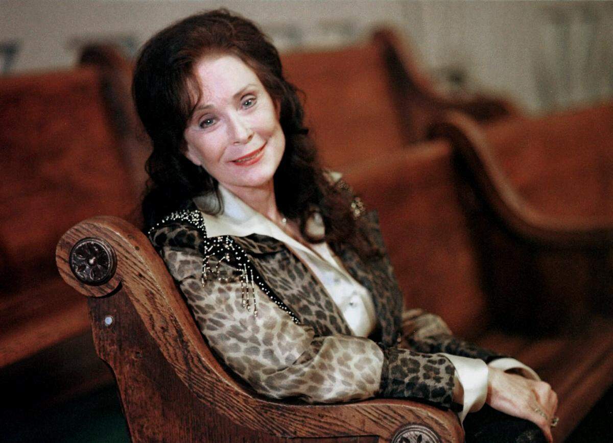 FILE - Country music great Loretta Lynn poses for a portrait in September 2000 in Nashville, Tenn. Lynn, the Kentucky coal miner’s daughter who became a pillar of country music, died Tuesday at her home in Hurricane Mills, Tenn. She was 90. (AP Photo/Christoper Berkey, File)