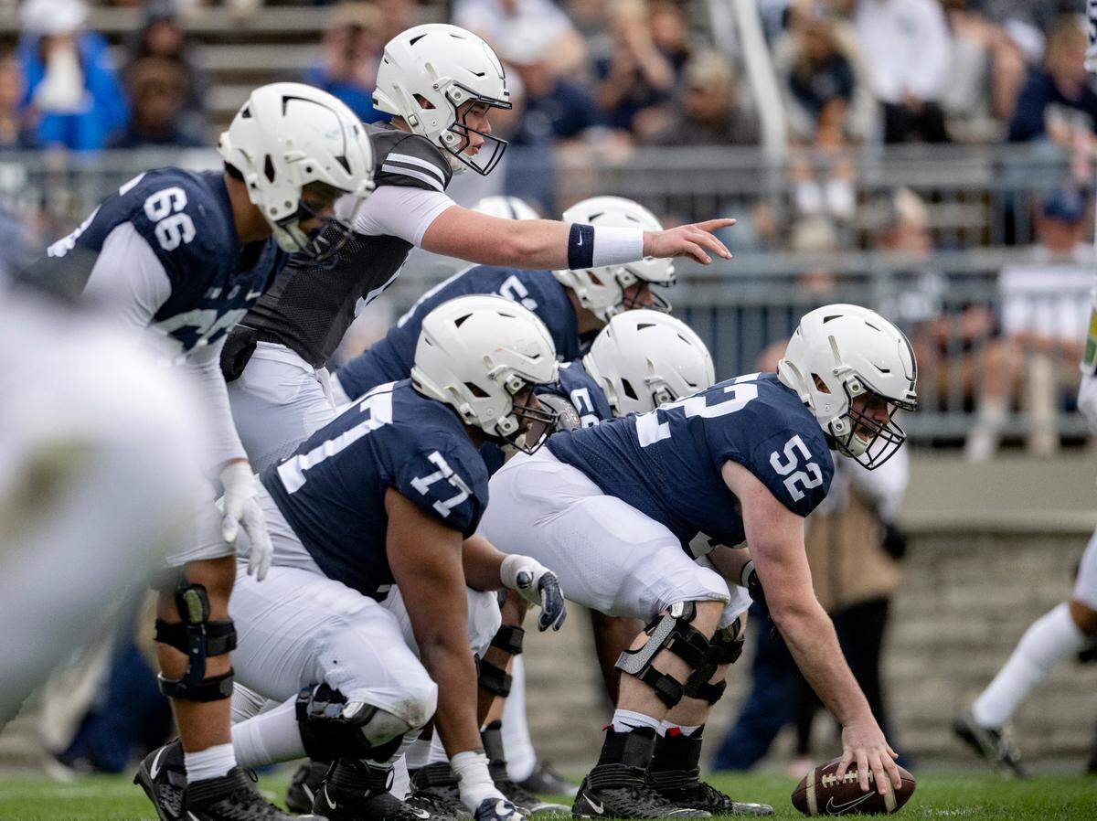 Quarterback Drew Allar yells to Dominic Rulli and the offensive line before a play during the Penn State Blue-White game on Saturday, April 15, 2023.