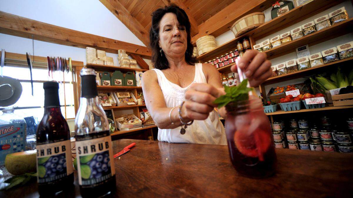 Kim Tait of Tait Farm Foods in Boalsburg makes a wild blueberry shrub in 2015. The farm’s Harvest Shop will hold holiday-themed events throughout December.