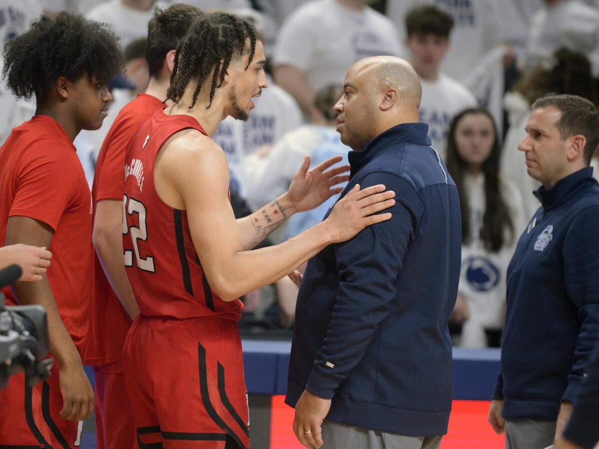 Penn State coach Micah Shrewsberry, center right, talks with Rutgers’ Caleb McConnell (22) after Penn State’s loss in their NCAA college basketball game, Sunday, Feb. 26, 2023 in State College.