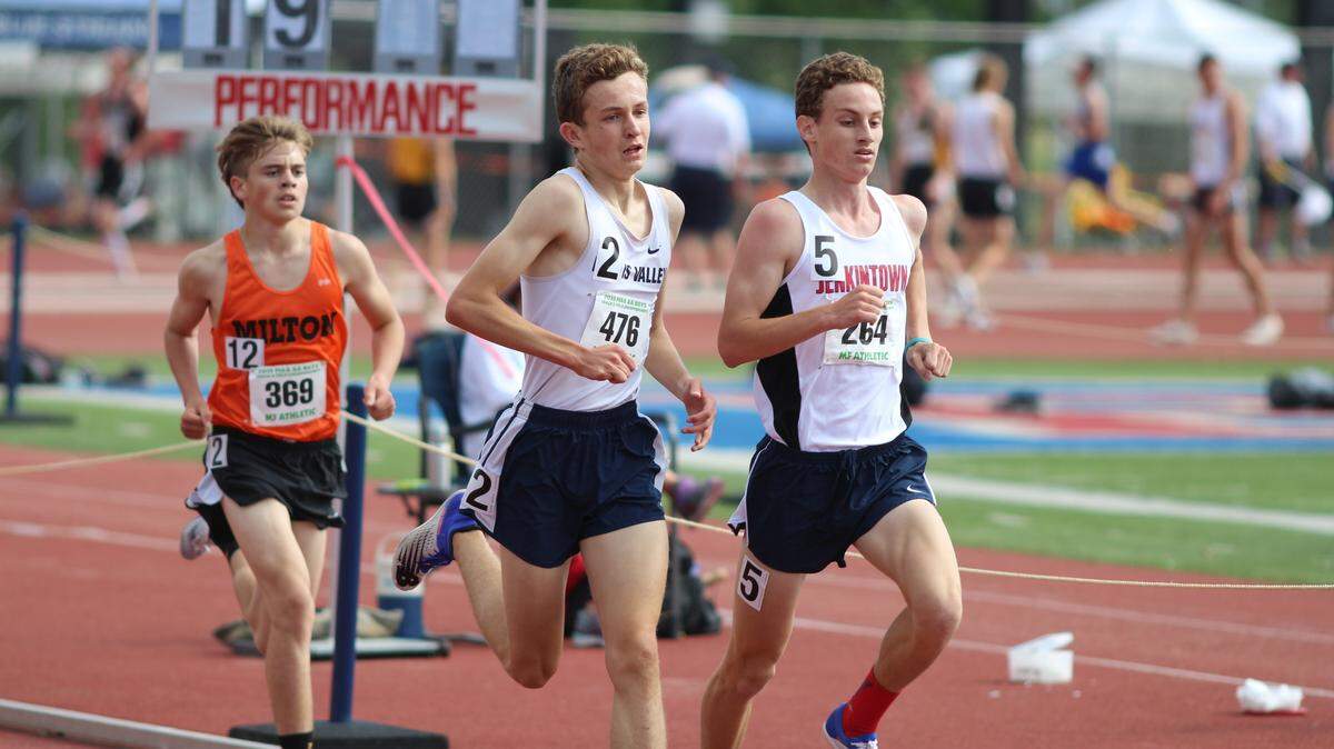 Penns Valley sophomore Colton Sands (middle) kept pace with Jenkintown’s Jack Miller (right) until pulling away in the final 200 meters of Saturday’s 3,200-meter run at the PIAA Class 2A Boys’ Track and Field Championships at Shippensburg’s Seth Grove Stadium. Sands won the gold in 9:24.75.