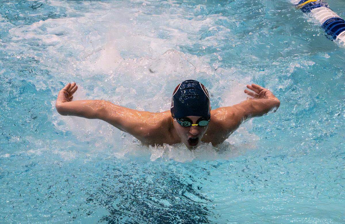 Swimmers compete in the 100 butterfly during the District 6 Swimming & Diving Championships in University Park, Pa., on Friday, Feb. 20, 2026.