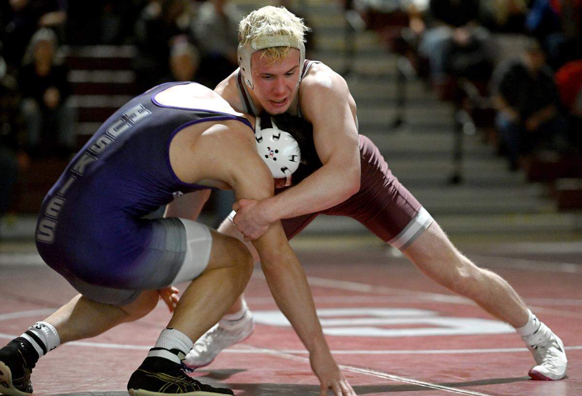 State College’s Pierson Manville wrestles Mifflin County’s Parker Kearns in the 152 lb bout of the match on Thursday, Jan. 25, 2024.