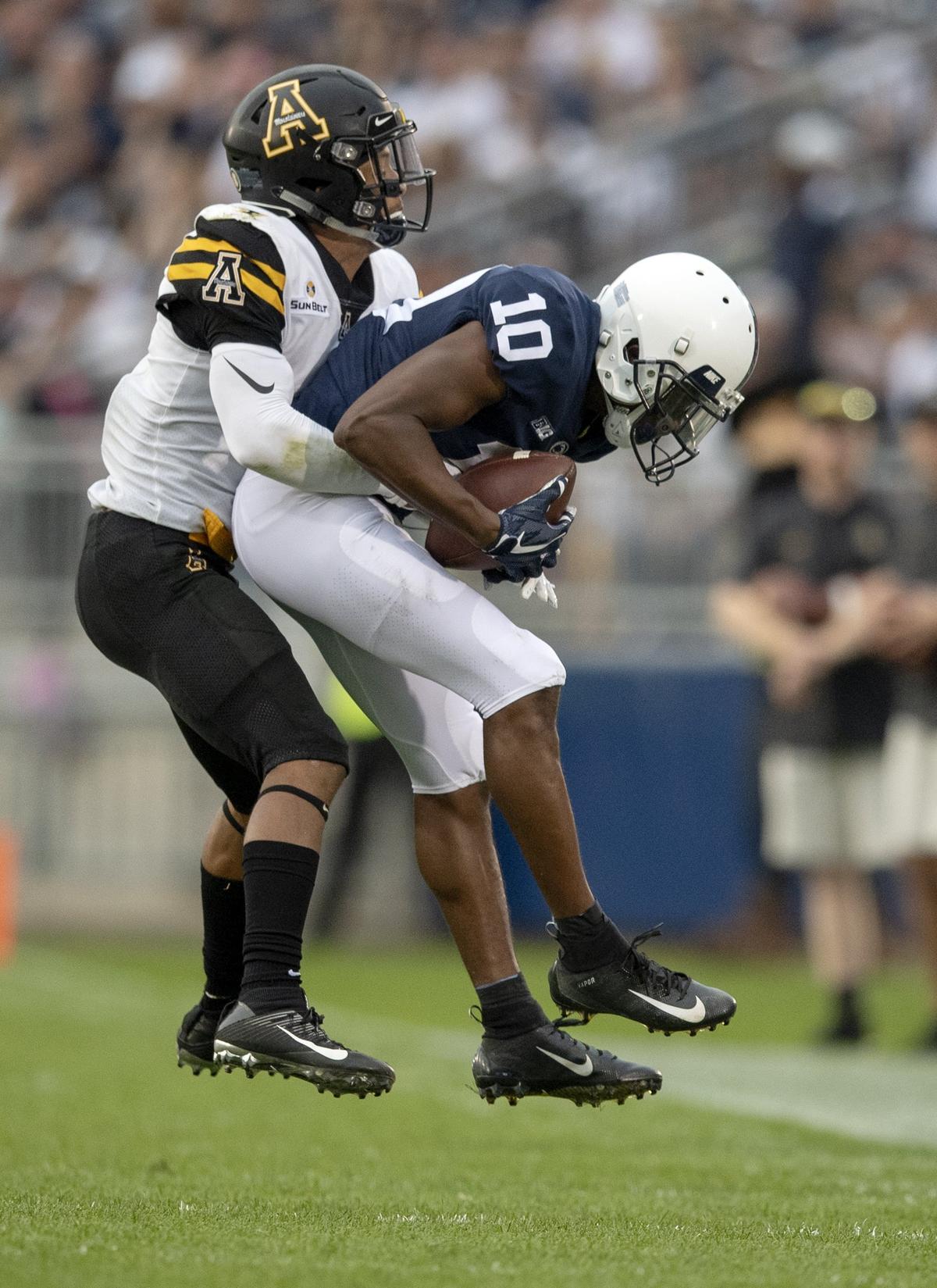 Penn State wide receiver Brandon Polk makes a catch ahead of an Appalachian State defender during the Saturday, Sept. 1, 2018 game at Beaver Stadium.