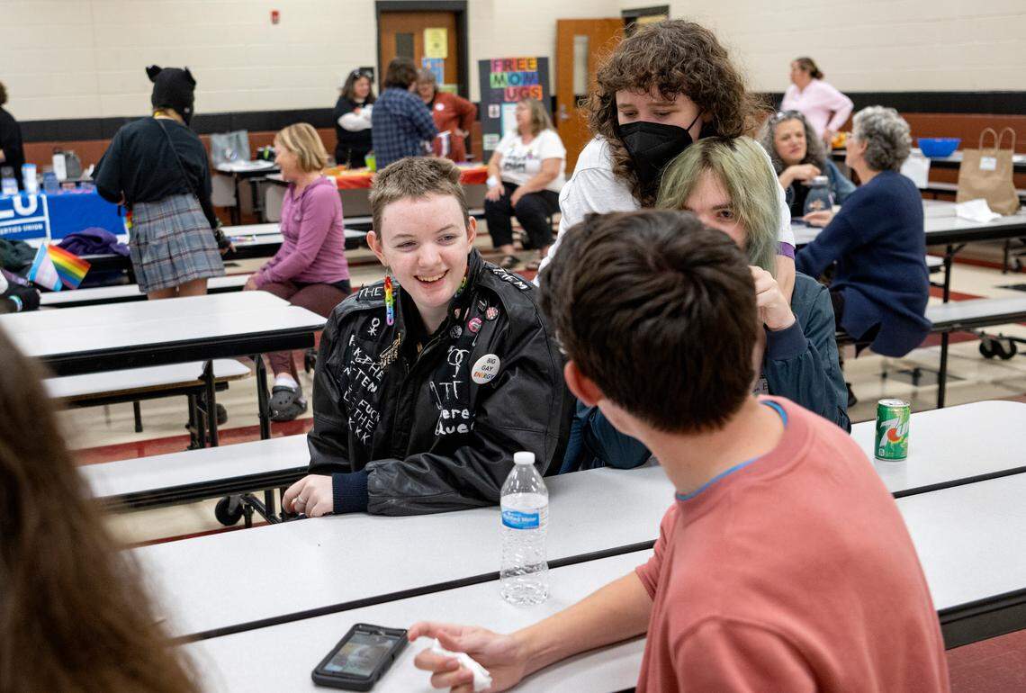 Crab Ewaskiewicz laughs with friends from the Penns Valley diversity club at the National Coming out Day event hosted but the Centre LGBTQA Support Network at Penns Valley Elementary on Tuesday, Oct. 11, 2022.