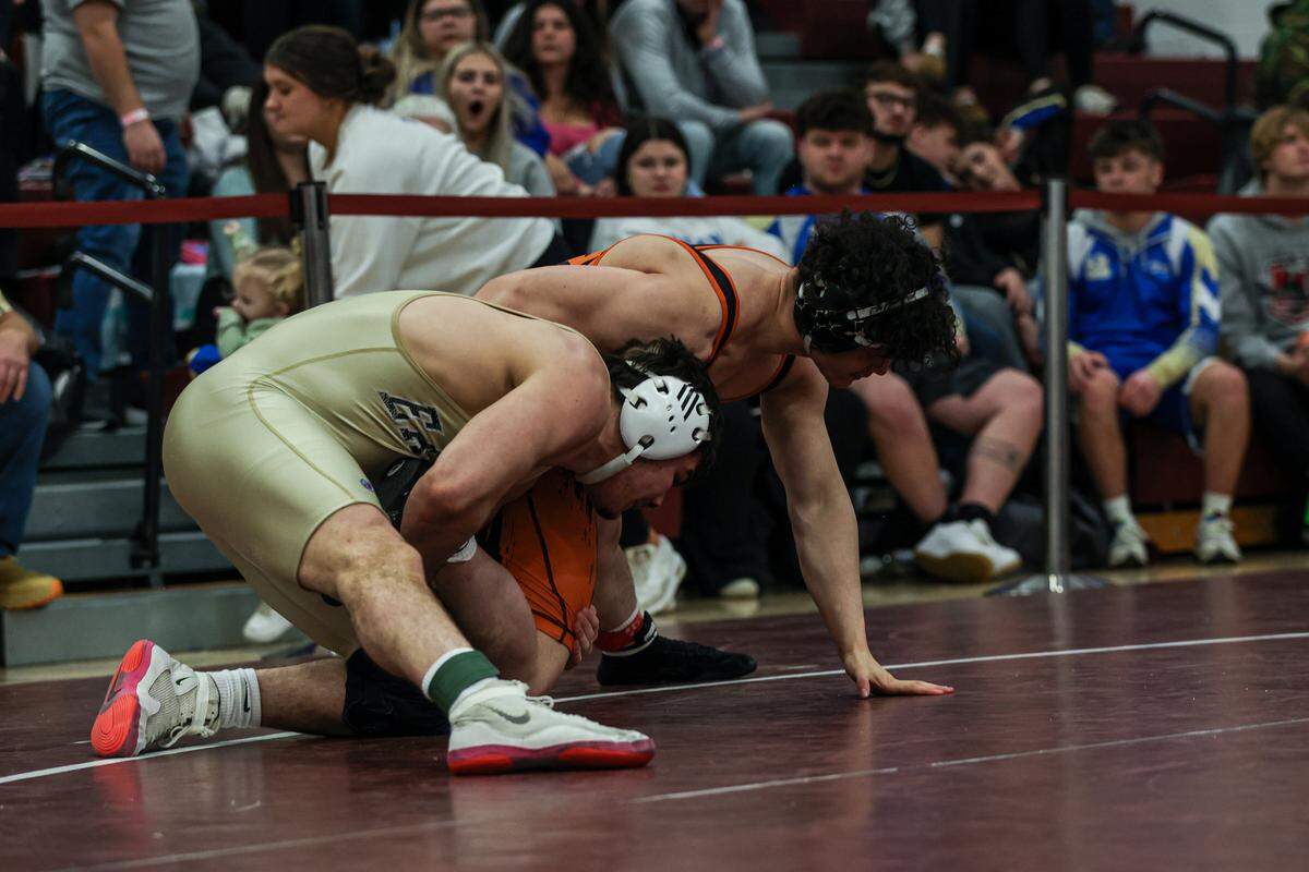 Bald Eagle Area’s Caleb Close looks to finish off a takedown of Tyrone’s Kyle Scott in their 189-pound finals match of the District 6 Class 2A Championships on Saturday in Altoona. Close beat Scott, 9-1, for his third district title.
