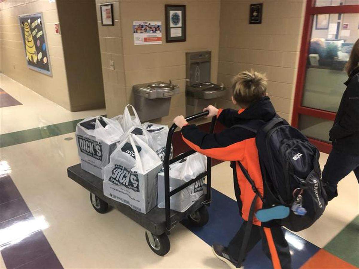 Joey Gearhart, a fifth-grader at Marion-Walker Elementary, is collecting shoes to give to students in the Bellefonte School District.