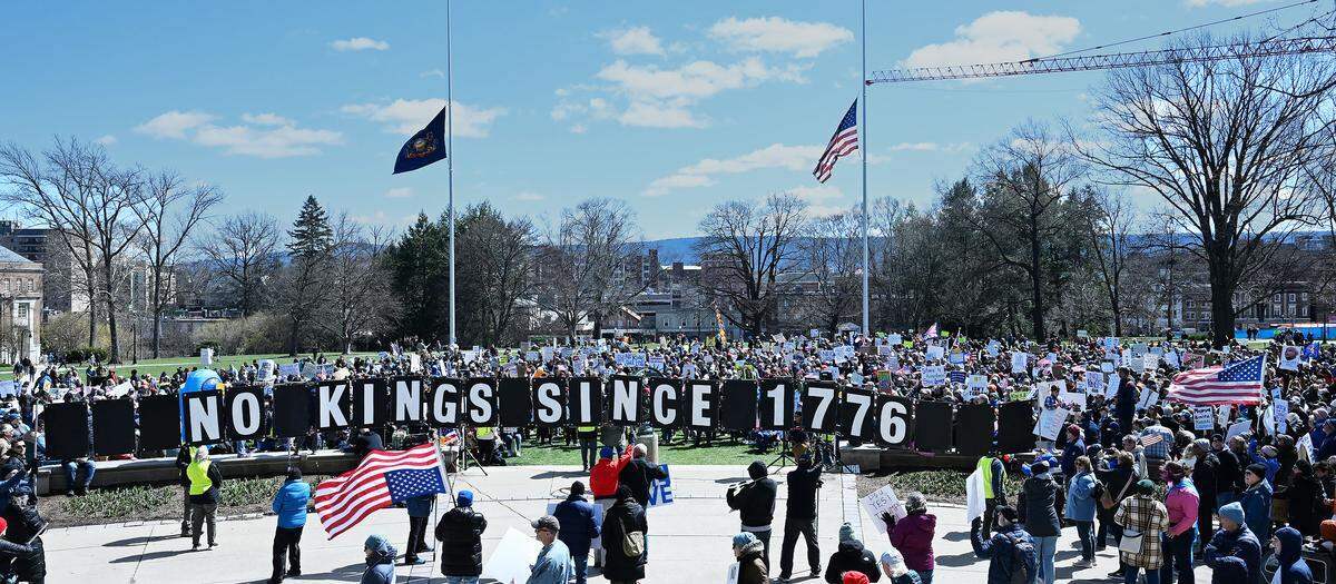 Thousands of people carrying signs gathered Saturday on Old Main lawn for the third No Kings rally.