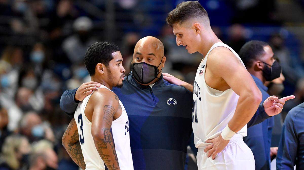Penn State men’s basketball coach Micah Shrewsberry talks to players Sam Sessoms and John Harrar during a timeout of the game against Youngstown State on Wednesday, Nov. 10, 2021.