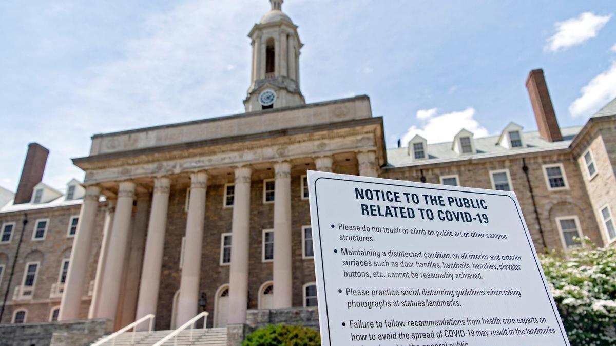 A sign promoting social distancing due to COVID-19 is pictured outside of Old Main on Monday, June 15, 2020.