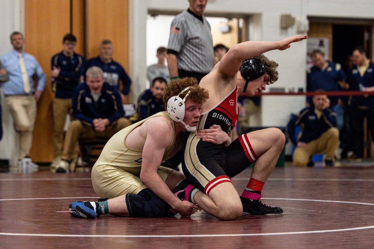 Bald Eagle Area’s Dawson Lomison controls Bishop McCort’s Jackson Butler in their 152-pounds finals match of the District 6 Class 2A Championships on Saturday, Feb. 14, 2026 in Altoona. Lomison topped Butler, 5-2.