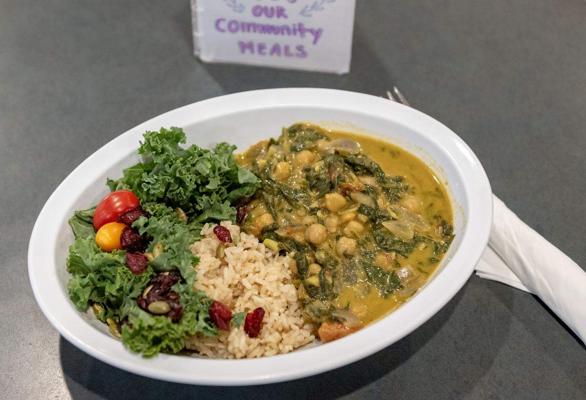 Chana Saag with rice and salad was the pay-what-you-can community meal at Webster’s Bookstore & Cafe on Wednesday, Nov. 19, 2025. The meal was vegan and gluten-free and free to those in need.
