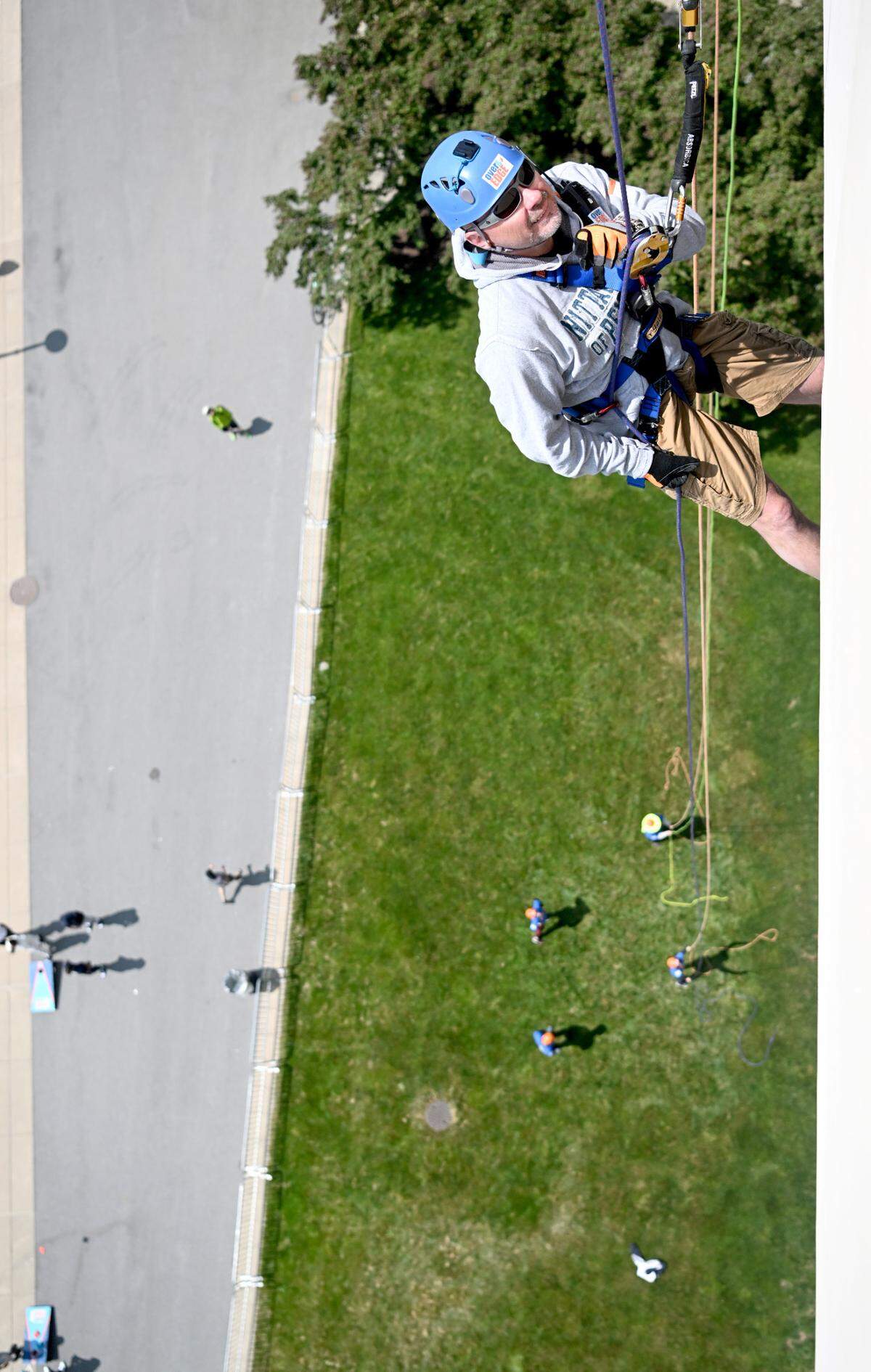 Bryan Wooster rappels down the side of Beaver Stadium for the Centre County United Way Over the Edge fundraiser on Friday, May 19, 2023.