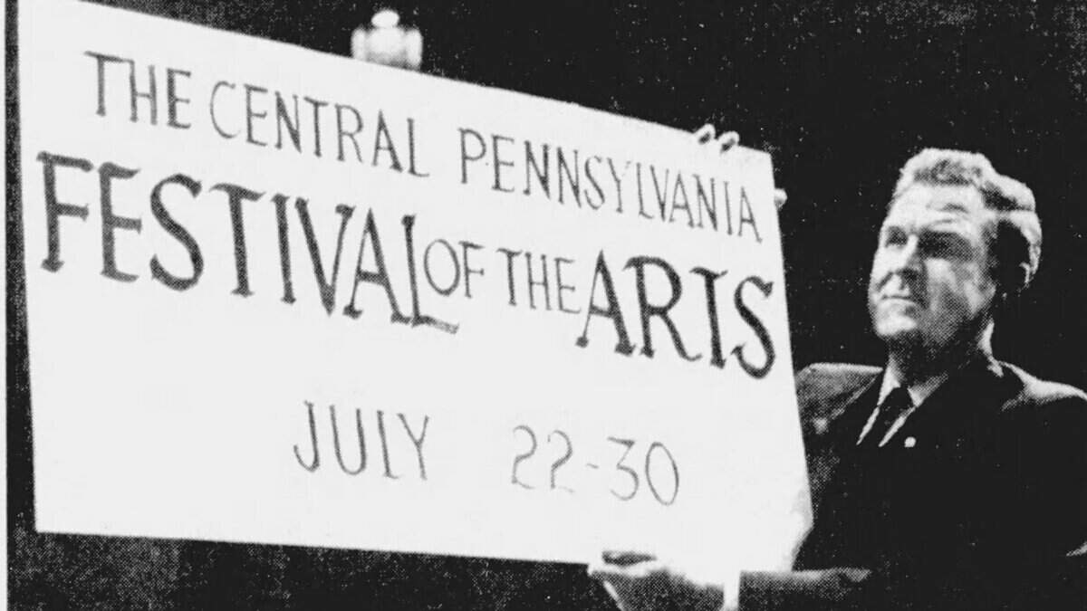 Pennsylvania Gov. Raymond P. Shafer poses in May 1967 with a poster announcing the first-ever Central Pennsylvania Festival of the Arts that was taking place just two months later. Shafer later helped open the first-ever Arts Fest by being on hand for the festivities and attending a local play.