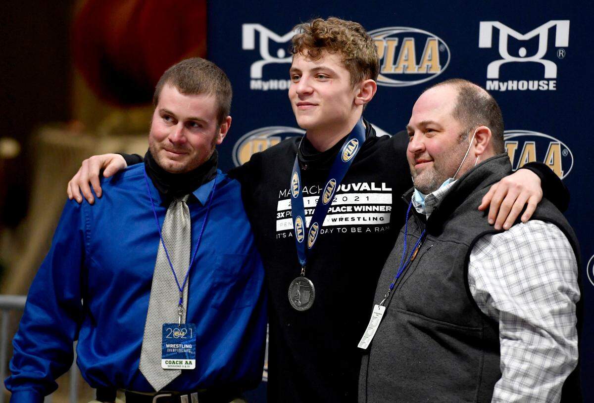 Penns Valley wrestling coaches with silver medalist Malachi DuVall at the PIAA AA wrestling championships on Friday, March 12, 2021 at the Hershey Giant Center.