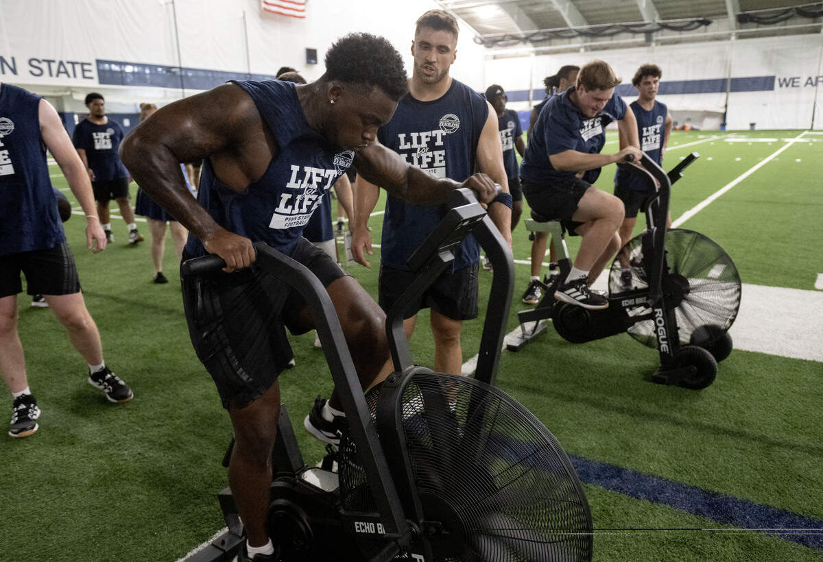 Penn State football players peddle on the bikes during Lift For Life on Wednesday, July 1, 2026.