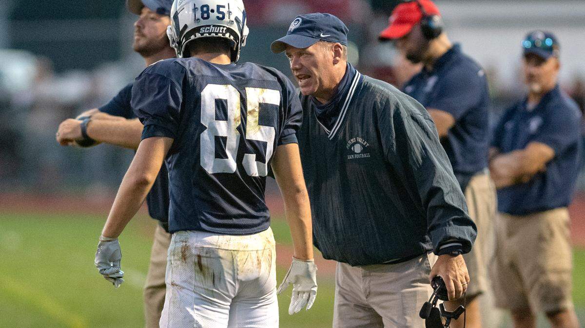 Penns Valley football coach Martin Tobias talks to Tanner Ilgen during the game against Philipsburg-Osceola on Sept. 17.