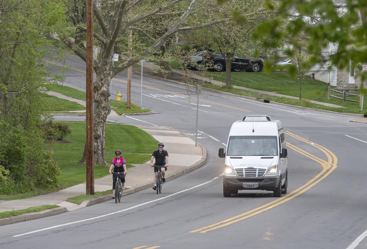 Two bikers make their way down Allen Street on April 30.