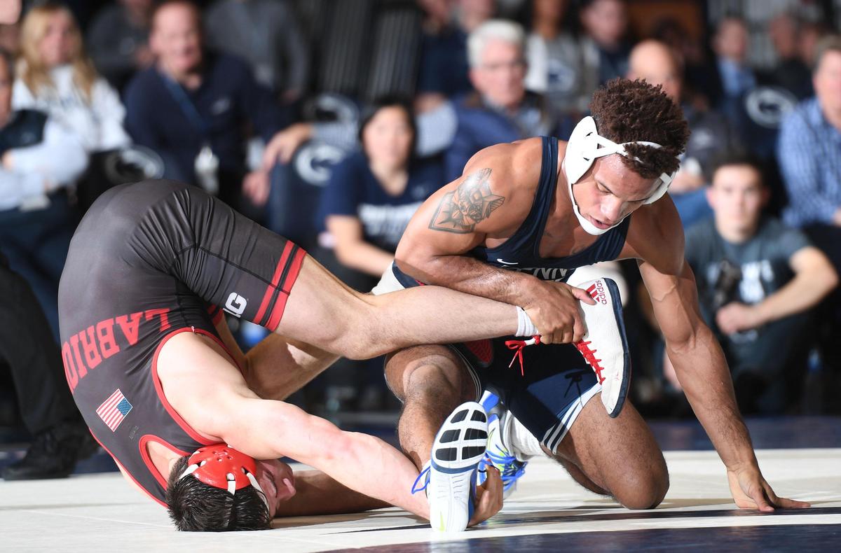 Penn State’s Mark Hall scrambles with Nebraska’s Mikey Labriola for a takedown Sunday during the Nittany Lions’ 25-6 win at Rec Hall. Hall defeated Labriola 5-3 at 174 pounds.